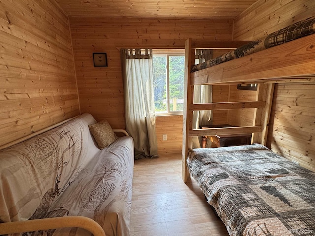 E8310 County Road 440th Hwy, Wetmore, MI 49895 - bedroom featuring wood walls, wooden ceiling, and wood finished floors
