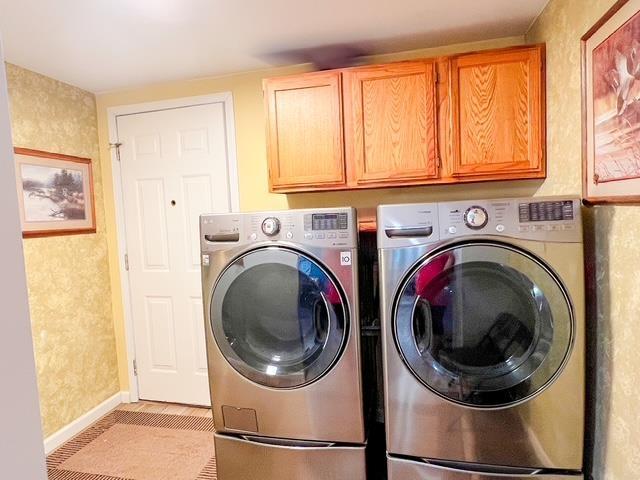 8855 Scotty Dr, Lake, MI 48632 - laundry room with washer and clothes dryer and cabinet space