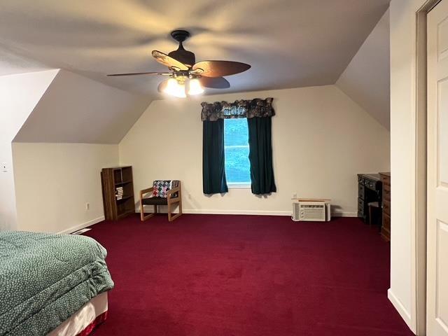 8855 Scotty Dr, Lake, MI 48632 - bedroom with vaulted ceiling, carpet, ceiling fan, and a wall mounted AC