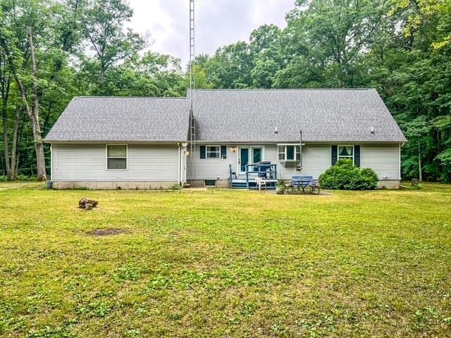 8855 Scotty Dr, Lake, MI 48632 - back of property featuring a lawn
