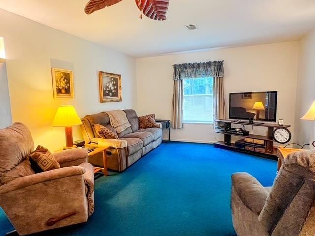 8855 Scotty Dr, Lake, MI 48632 - carpeted living area featuring a ceiling fan and baseboards