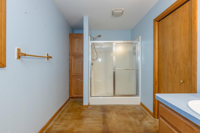 3833 Hermansau Rd, Saginaw, MI 48603 - full bathroom with a stall shower, vanity, and concrete floors