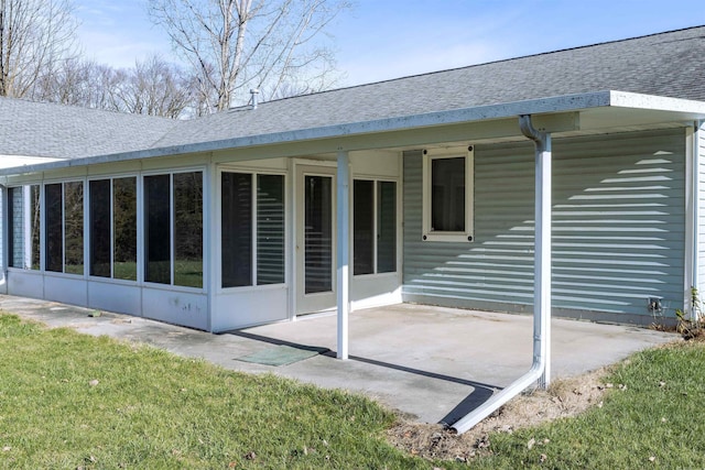 3833 Hermansau Rd, Saginaw, MI 48603 - back of house with a patio area, roof with shingles, and a sunroom