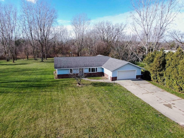 3833 Hermansau Rd, Saginaw, MI 48603 - ranch-style house with a garage, concrete driveway, and a front lawn