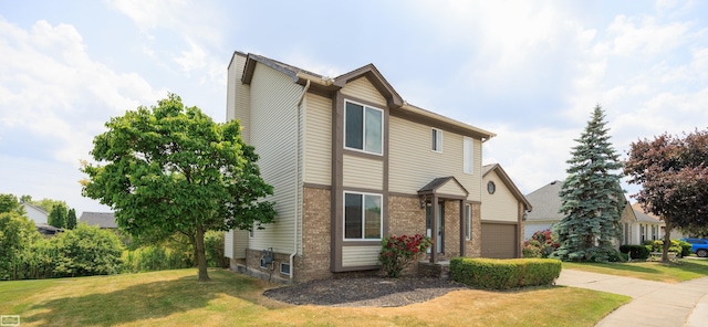 46395 Greenbriar St, Chesterfield Twp, MI 48051 - view of front facade featuring a front lawn, brick siding, and an attached garage