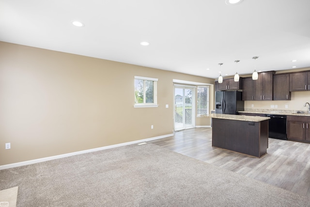 46395 Greenbriar St, Chesterfield Twp, MI 48051 - kitchen featuring black appliances, dark brown cabinets, a center island, recessed lighting, and pendant lighting