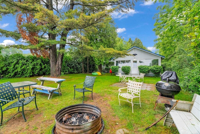 1159 S Lakeshore Rd, Carsonville, MI 48419 - view of green lawn featuring an outdoor fire pit