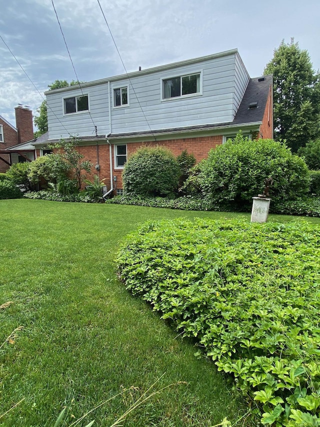 1782 Hollywood St, Grosse Pointe Woods, MI 48236 - back of property featuring brick siding and a lawn