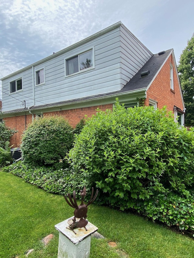 1782 Hollywood St, Grosse Pointe Woods, MI 48236 - view of side of property with brick siding and a lawn