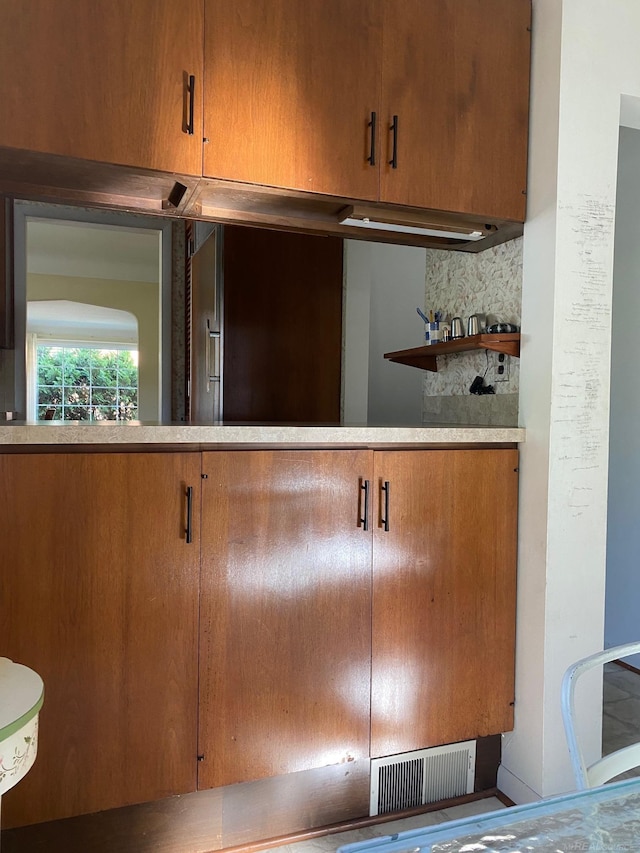 1782 Hollywood St, Grosse Pointe Woods, MI 48236 - kitchen view of decorative backsplash and brown cabinetry