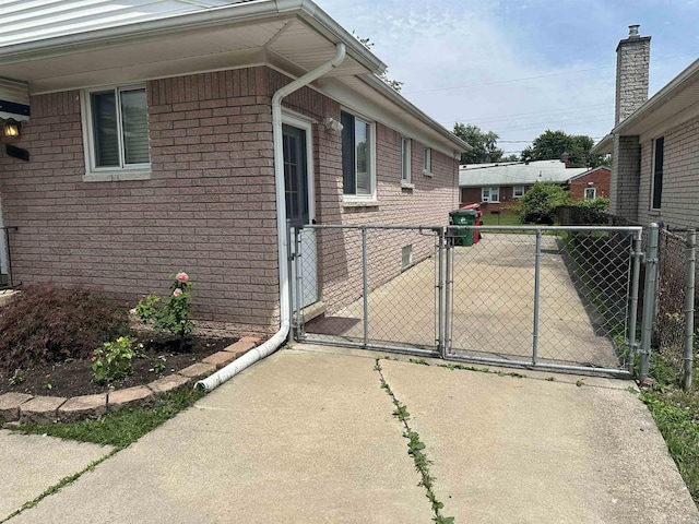 23072 Rein Ave, Eastpointe, MI 48021 - view of home's exterior featuring a gate and brick siding