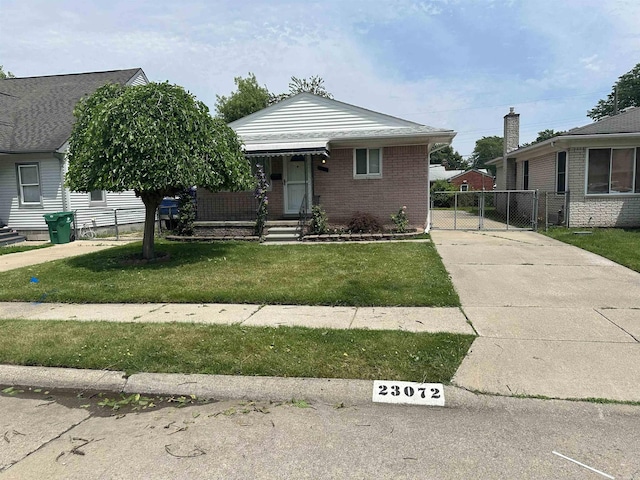 23072 Rein Ave, Eastpointe, MI 48021 - view of front of house with a gate and brick siding