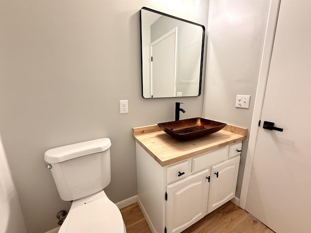 3331 Lakeshore Dr, Gladwin, MI 48624 - half bath with wood finished floors and vanity