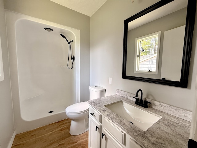3331 Lakeshore Dr, Gladwin, MI 48624 - bathroom featuring wood finished floors, a shower, and vanity