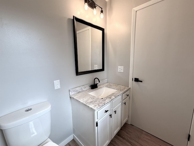 3331 Lakeshore Dr, Gladwin, MI 48624 - half bath with vanity and wood finished floors