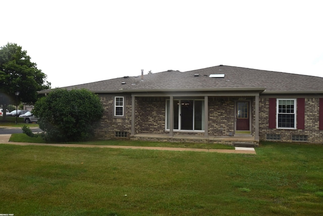 11186 Spruce Ct Unit 105, Washington Twp, MI 48094 - view of front facade with a front lawn, brick siding, a shingled roof, and crawl space
