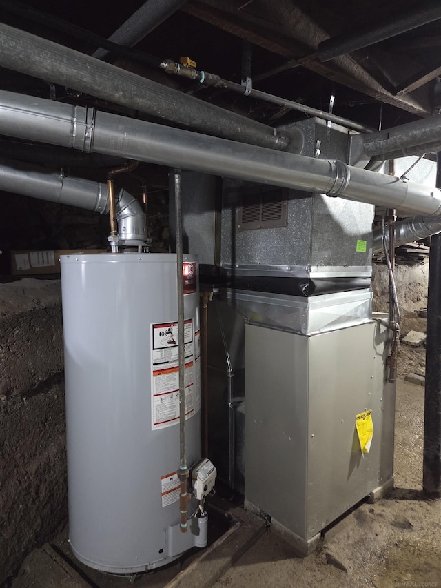 321 Lamson St, Grand Ledge, MI 48837 - utility room with water heater and heating unit