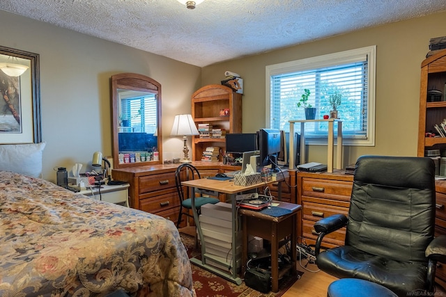 38114 Huron Pointe Dr, Harrison Twp, MI 48045 - bedroom featuring multiple windows, a desk, wood finished floors, and a textured ceiling