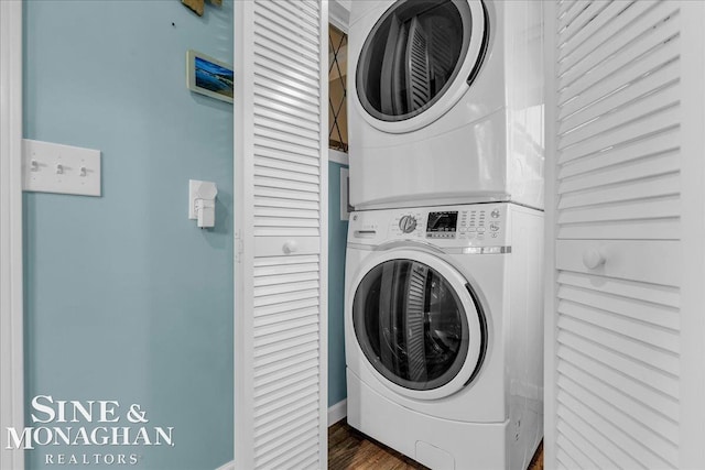 421 Edgewater Dr, Algonac, MI 48001 - laundry area featuring stacked washer and clothes dryer and wood finished floors