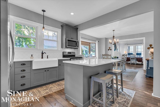 421 Edgewater Dr, Algonac, MI 48001 - kitchen with stainless steel appliances, gray cabinets, healthy amount of natural light, and recessed lighting