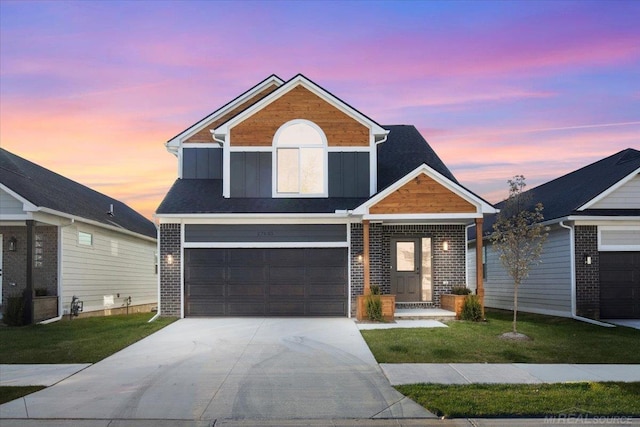 27633 Maryjane Ln E, Chesterfield Twp, MI 48047 - view of front of home with driveway, a lawn, a garage, and brick siding