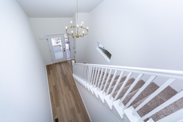 27602 Maryjane Ln E, Chesterfield Twp, MI 48047 - staircase with wood finished floors and a chandelier