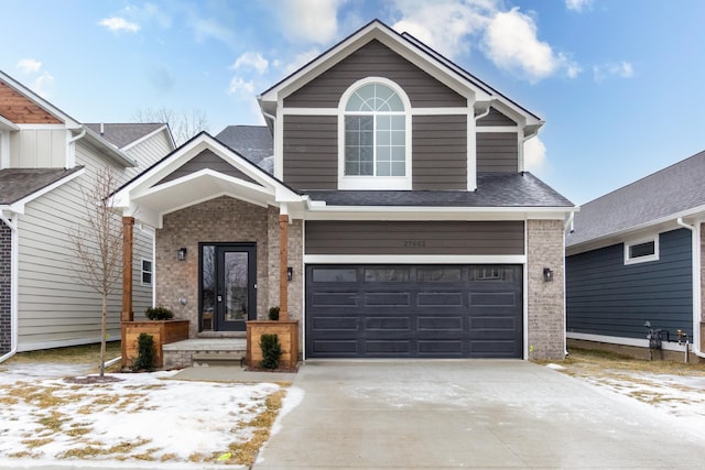 27602 Maryjane Ln E, Chesterfield Twp, MI 48047 - view of front of house with brick siding, a garage, driveway, and a shingled roof