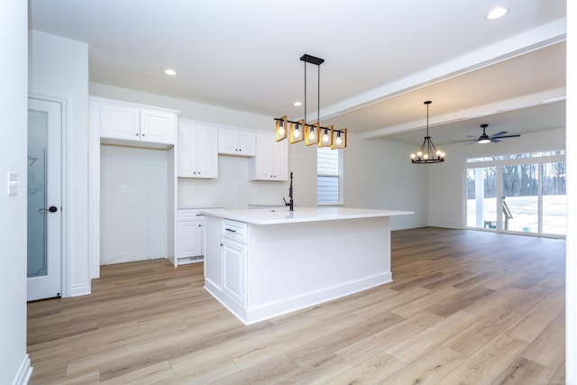 27602 Maryjane Ln E, Chesterfield Twp, MI 48047 - kitchen with light wood-style flooring, healthy amount of natural light, white cabinetry, recessed lighting, and a ceiling fan