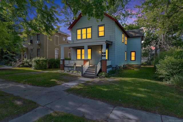 734 Court St, Port Huron, MI 48060 - view of front of house with a porch and a front lawn