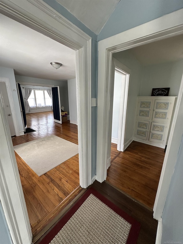 734 Court St, Port Huron, MI 48060 - corridor featuring wood finished floors and lofted ceiling