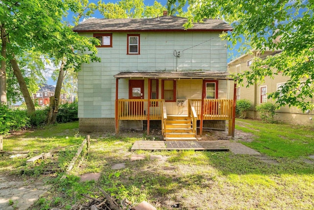 734 Court St, Port Huron, MI 48060 - rear view of house featuring a lawn, a chimney, and roof with shingles