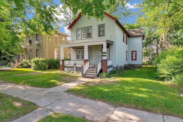 734 Court St, Port Huron, MI 48060 - view of front of home with covered porch and a front lawn