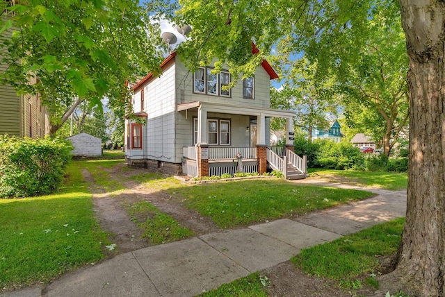 734 Court St, Port Huron, MI 48060 - view of front of home featuring covered porch and a front lawn