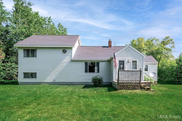 719 S Carlshend Rd, Skandia, MI 49885 - rear view of property featuring a chimney, roof with shingles, a lawn, and a deck