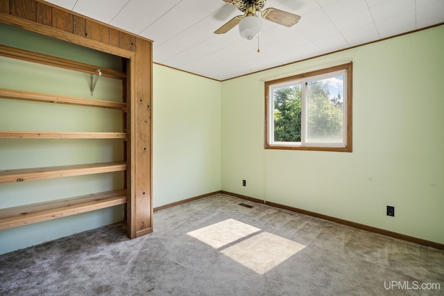719 S Carlshend Rd, Skandia, MI 49885 - unfurnished bedroom with carpet, a closet, and ceiling fan