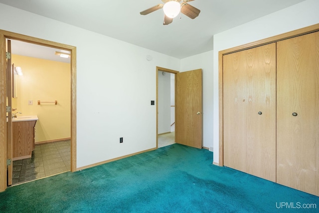 719 S Carlshend Rd, Skandia, MI 49885 - unfurnished bedroom with connected bathroom, a closet, carpet flooring, and ceiling fan