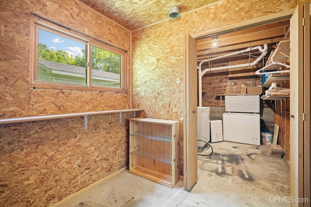 719 S Carlshend Rd, Skandia, MI 49885 - below grade area featuring fridge