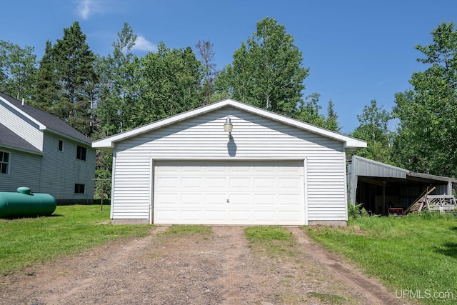 719 S Carlshend Rd, Skandia, MI 49885 - detached garage featuring dirt driveway