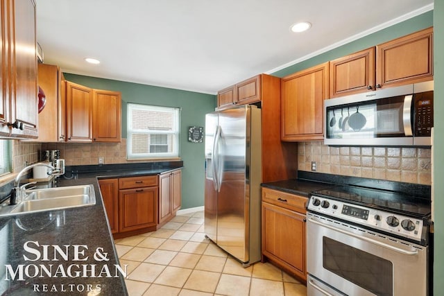1387 Torrey Rd, Grosse Pointe Woods, MI 48236 - kitchen with appliances with stainless steel finishes, backsplash, light tile patterned flooring, dark countertops, and recessed lighting