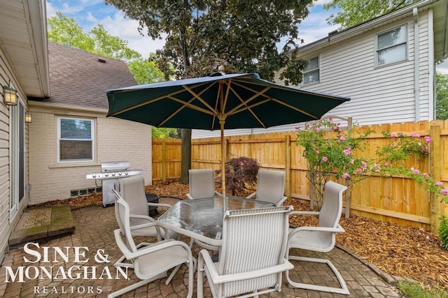 1387 Torrey Rd, Grosse Pointe Woods, MI 48236 - fenced backyard with outdoor dining space, area for grilling, and a patio