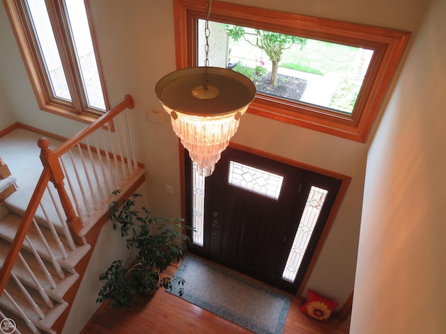 46778 Tiffin Ct, Chesterfield, MI 48047 - entrance foyer with healthy amount of natural light, stairway, and wood finished floors