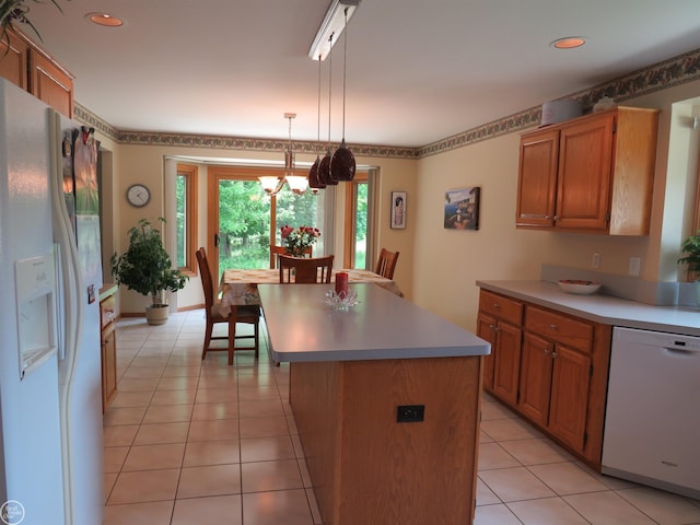 46778 Tiffin Ct, Chesterfield, MI 48047 - kitchen with white appliances, a chandelier, light countertops, brown cabinets, and recessed lighting