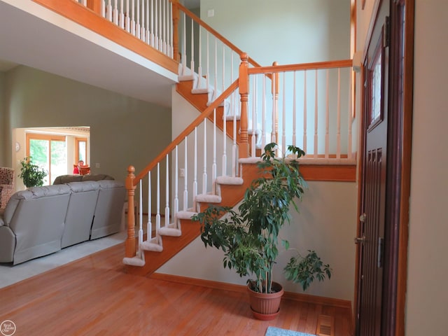 46778 Tiffin Ct, Chesterfield, MI 48047 - foyer entrance featuring wood finished floors, stairway, and a towering ceiling