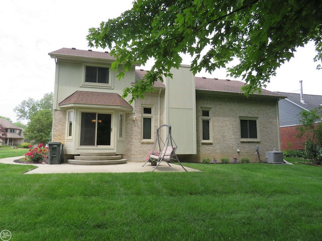 46778 Tiffin Ct, Chesterfield, MI 48047 - back of house with entry steps, a yard, and brick siding