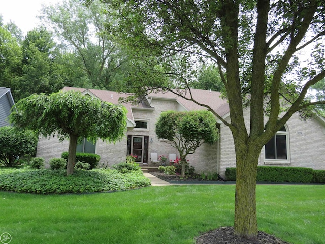 46778 Tiffin Ct, Chesterfield, MI 48047 - view of front facade featuring brick siding and a front yard