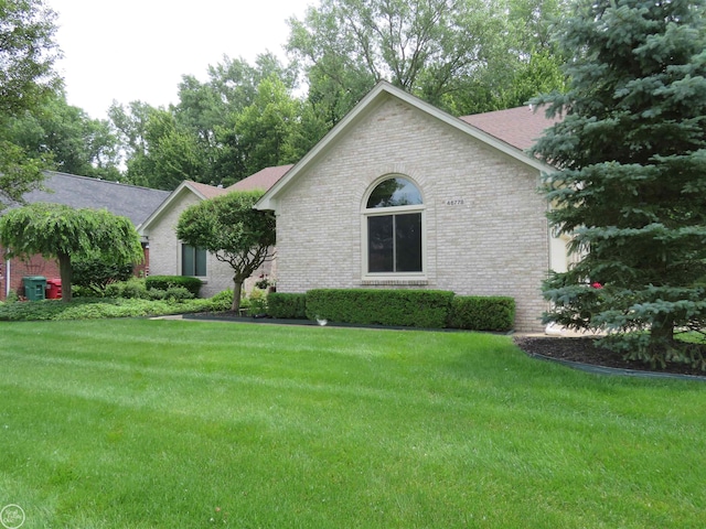 46778 Tiffin Ct, Chesterfield, MI 48047 - ranch-style house featuring brick siding, a front lawn, and roof with shingles