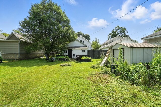 618 Harrison St, Monroe, MI 48161 - fenced backyard with a shed