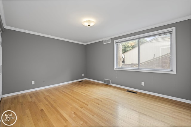 870 Crescent Ln, Grosse Pointe Woods, MI 48236 - empty room with crown molding and light wood-style flooring