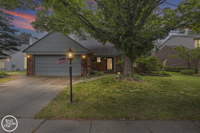 870 Crescent Ln, Grosse Pointe Woods, MI 48236 - view of front facade with brick siding, concrete driveway, an attached garage, and a yard