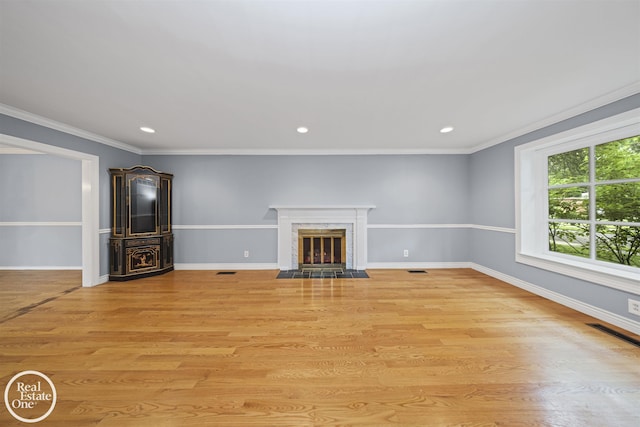 870 Crescent Ln, Grosse Pointe Woods, MI 48236 - unfurnished living room featuring light wood finished floors, recessed lighting, a premium fireplace, and ornamental molding